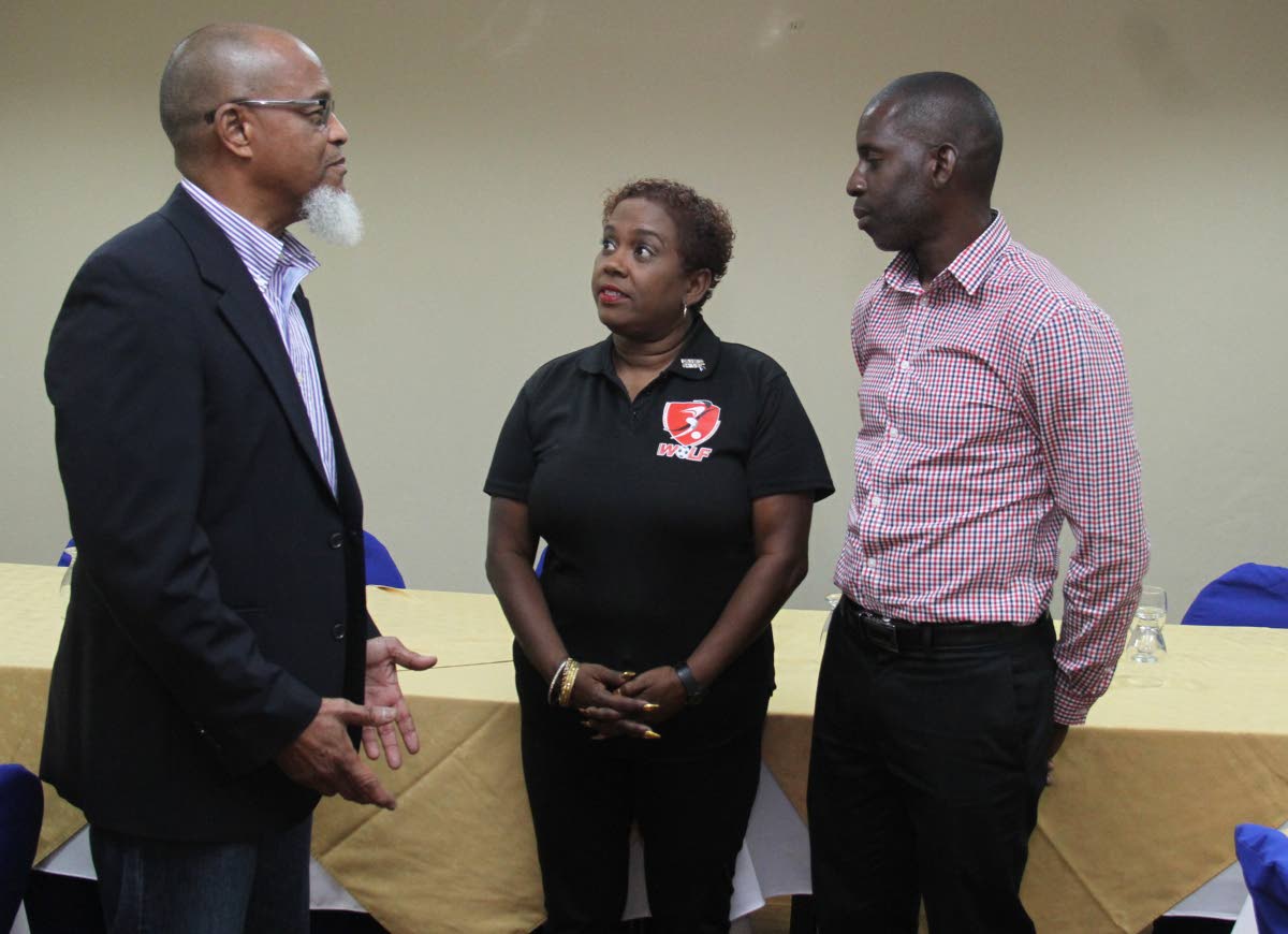 President of the TT Super League and board member of the TT Football Association (TTFA) Keith Look Loy, left, chats with president of the TT Women's League Football (WoLF) Susan Joseph-Warrick and board member of the Northern Football Association secretary Rayshawn Mars,right, at a press conference , held at the Normandie Hotel, yesterday.