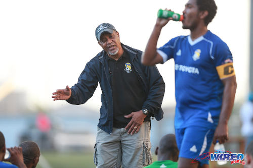 Photo: FC Santa Rosa coach Keith Look Loy (centre) talks to his players at halftime while then captain Jovan Rochford (right) has a drink of water during 2015/16 CNG National Super League (NSL) Premiership Division action against Club Sando Moruga at the Marvin Lee Stadium in Macoya. (Courtesy Nicholas Bhajan/Wired868)