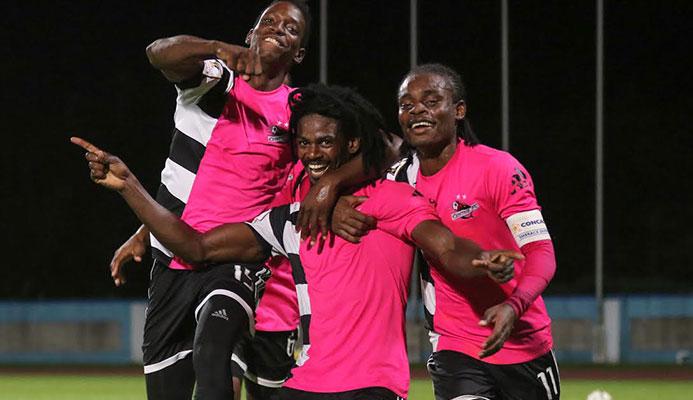 ​​Photo: Central FC's Jason Marcano, centre, in celebration with teammates Kaydion Gabriel and Darren Mitchell.