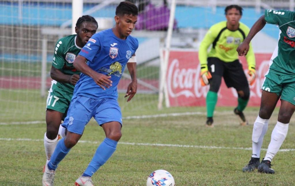 Naparima College’s Mark Ramdeen controls the ball in the Coca-Cola National Intercol final, against San Juan North Secondary, at the Ato Boldon Stadium, Couva, yesterday.