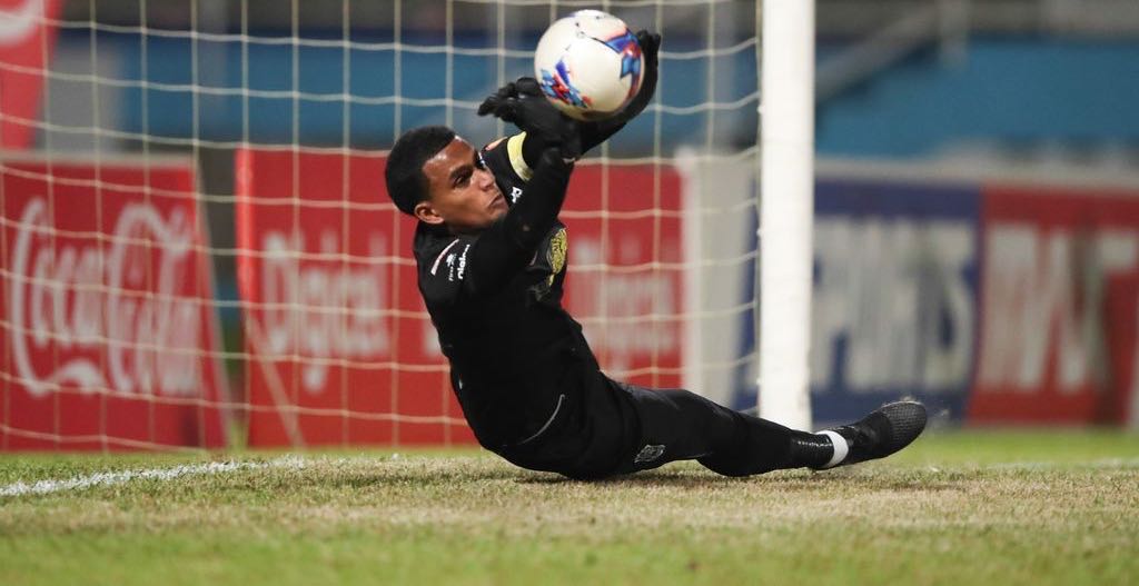 SAVE Naparima goalkeeper Levi Fernandez makes the first save in the sudden death penalty shoot out during the Coca-Cola Intercol National Boys’ final between Naparima College and San Juan Secondary at the Ato Boldon Stadium, Couva, last evening. Naparima won 4-3 on penalties.