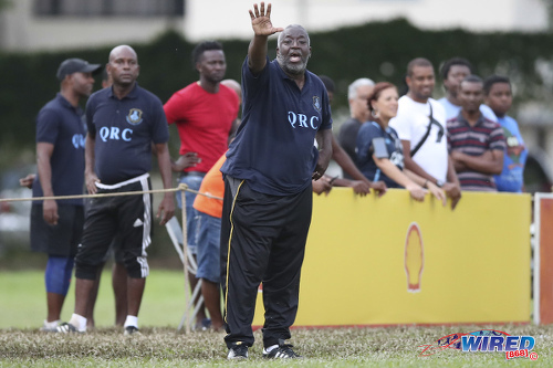 Photo: Queen’s Royal College (QRC) head coach Nigel Grosvenor gestures to his players during a SSFL contest against Carapichaima East Secondary on 30 September 2017. (Courtesy Allan V Crane/Wired868)