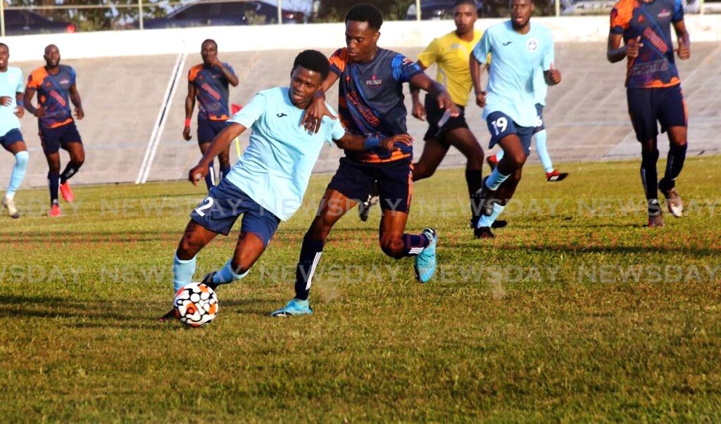 Police player Tyrese Bailey ( L) vies for control of the ball as Deportive Point Fortin’s Eziekiel Kessar (R) defends, during the Ascension League football match, at the Arime Veledrome on Saturday. - SUREASH CHOLAI
