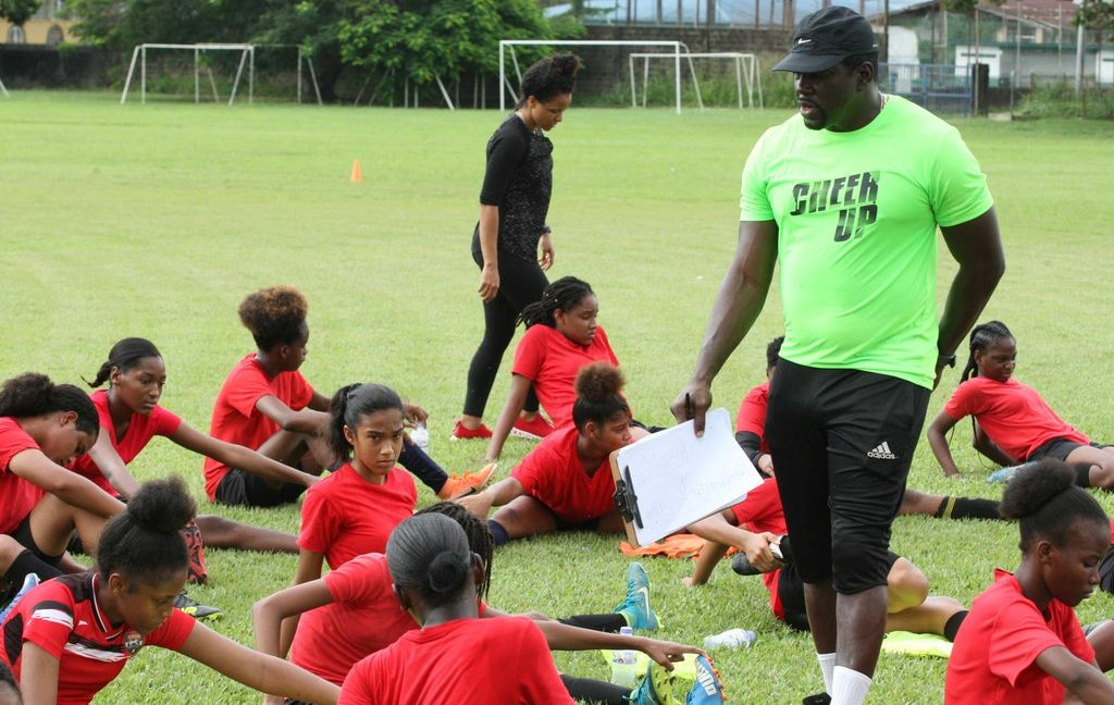 Coach Richard Hood talks to players during the TTFA Girls Under-17 Screening session at St Mary’s College, Grounds, St Clair in December 2019.