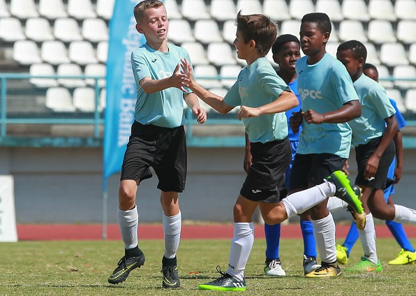 QPS players celebrate a goal during their match against a South Zone Under-12 team during the Republic Bank Youth Football League at Larry Gomes Stadium, Malabar, Arima. PICTURE MATTHEW LEE KONG