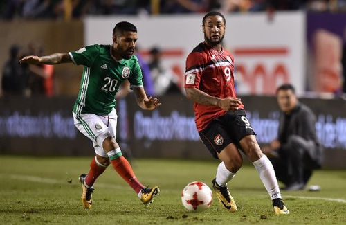 Photo: Trinidad and Tobago forward Shahdon Winchester (right) tries to keep the ball from Mexico winger Javier Aquino during World Cup qualifying action in San Luis Potosi, Mexico on 6 October 2017. ...(Copyright AFP 2017/Yuri Cortez)