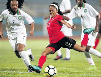 T&T’s Summer Shenelle Arjoon attempts a shot at goal during the CFU Women’s Challenge Series 2018 between T&T and Suriname at the Ato Boldon Stadium, Couva on Wednesday. T&T won 7-0. PICTURE MATTHEW LEE KONG