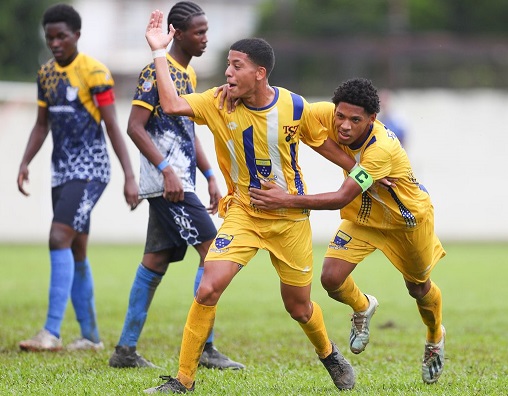 Fatima's Aidan De Gannes, centre, celebrates with his captain, Christian Bailey, right after scoring against Speyside Secondary during the Secondary School Football League Premiership match at the Hasely Crawford Stadium in Mucurapo, Port-of-Spain, on Wednesday. Fatima won 8-0 (Photo by Daniel Prentice)
