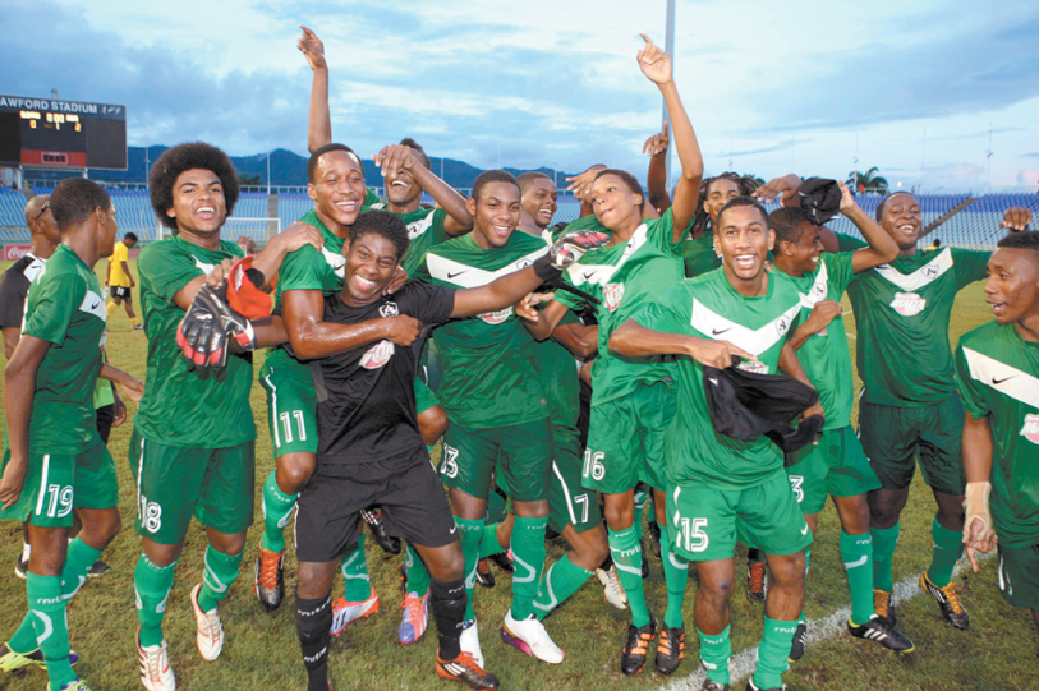 GOOD TO BE GREEN: St Augustine Secondary players, fans and technical staff celebrate their 2013 Coca Cola InterCol title at Hasely Crawford Stadium after whipping Fatima College 4-1 at the Mucurapo venue to secure the trophy. St AugustineÂ’s victory ended a 29-year drought in the competition. Â—Photo: JERMAINE CRUICKSHANK