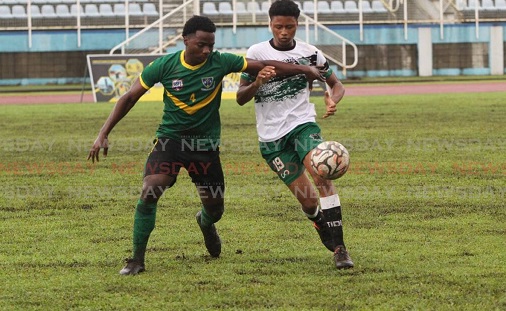 St Benedict’s Keanu Morean (L) and St Augustine Secondary School’s Marcel Valentine vie for the ball during the Secondary Schools Football League match, on October 12, at the Ato Boldon Stadium. - AYANNA KINSALE