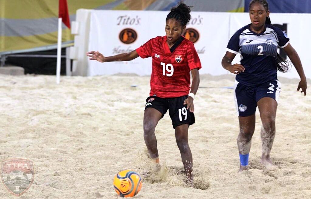 T&T's Alexcia Ali (L) dribbles the ball during the Bahamas Beach Soccer Cup 2022 match against Turks and Caicos, on Friday, in Nassau, Bahamas. - TTFA Media