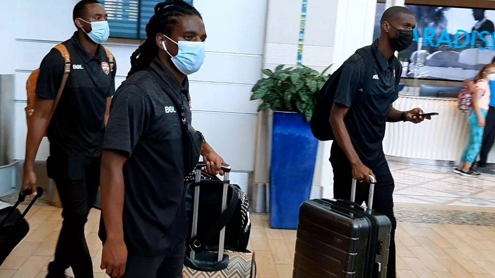 Duane Muckette, centre, goalkeeper Adrian Foncette and Hashim Arcia, right as the team arrives at the International Airport in Nassau on Saturday.