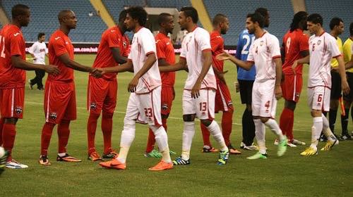 Flashback: Members of the Trinidad and Tobago and United Arab Emirates team meet each before the kick off in their 2013 encounter.