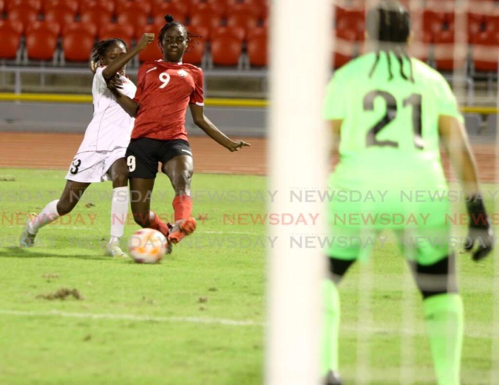 T&T "A" striker J'Eleisha Alexander, right, in action against T&T "B" on Sunday in the Jewels of the Caribbean tournament at the Hasely Crawford Stadium, Mucurapo on Sunday. - Angelo Marcelle
