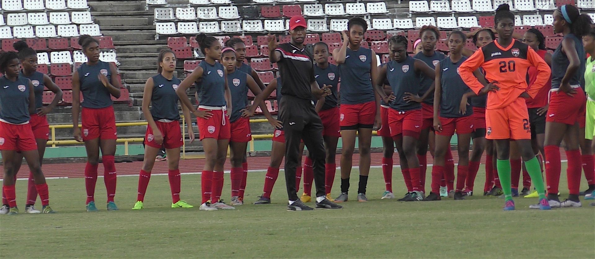 Photo caption – At top shows members of the Under 20 team during the warm up with trainer Saran Joseph at the Hasely Crawford Stadium on Tuesday. (Photo/TTFA Media)