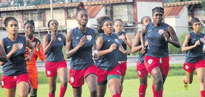 Brittney Williams, left, Demeisha Bailey, centre, Laurelle Theodore, right and Natisha John, far right lead the National U20 women’s team through their paces during a practice session at the training grounds, Hasely Crawford Stadium.