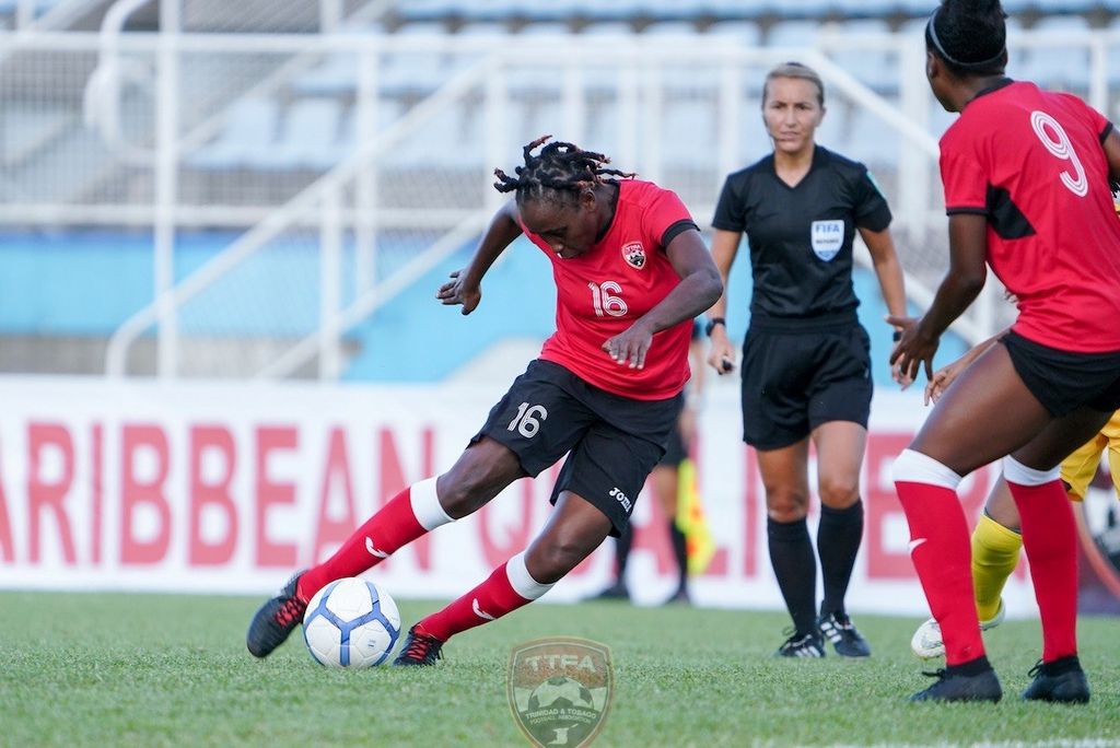 Dennecia Prince, left, scored the lone item for T&T in the host team’s 4-1 loss to St Kitts and Nevis in their Group A CONCACAF Women’s Olympic Qualifier at Ato Boldon Stadium, Couva, yesterday.