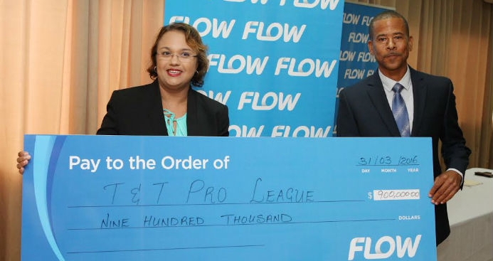 ​Flow Trinidad director of marketing Cindy Ann Gatt (left) presents TT Pro League CEO Dexter Skeene with a promotional cheque during the launch of a three-year partnership assigned to the Youth Pro League at the Hasely Crawford Stadium in Port-of-Spain on March 31, 2016.