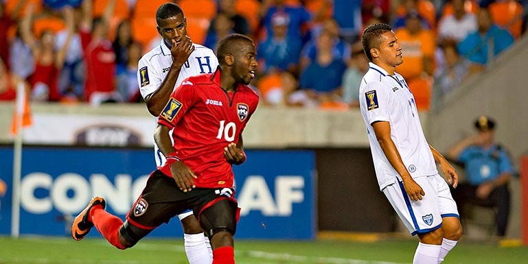 Trinidad & Tobago clinched a place in the CONCACAF Gold Cup quarterfinals, defeating 10-man Honduras 2-0 on Monday at BBVA Compass Stadium. Kenwyne Jones and Kevin Molino scored second-half goals in the triumph.