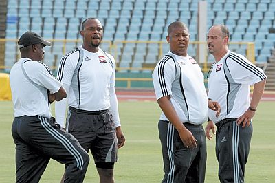 Newly appointed Soca Warriors coach Stephen Hart, from right, with assistant coach Derek King, Jefferson George, goalkeeping coach and assistant coach Hutson Charles during a practice session at the Hasely Crawford Stadium, Mucurapo, yesterday. The local team is preparing for next month’s Concacaf Gold Cup in the US. Photo: Anthony Harris