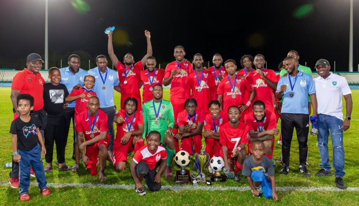 1976 FC Phoenix players, officials and supporters celebrate winning the Tobago Ascension Football League title at the Dwight Yorke Stadium, Bacolet, Tuesday December 20th 2022. PHOTO: David Reid