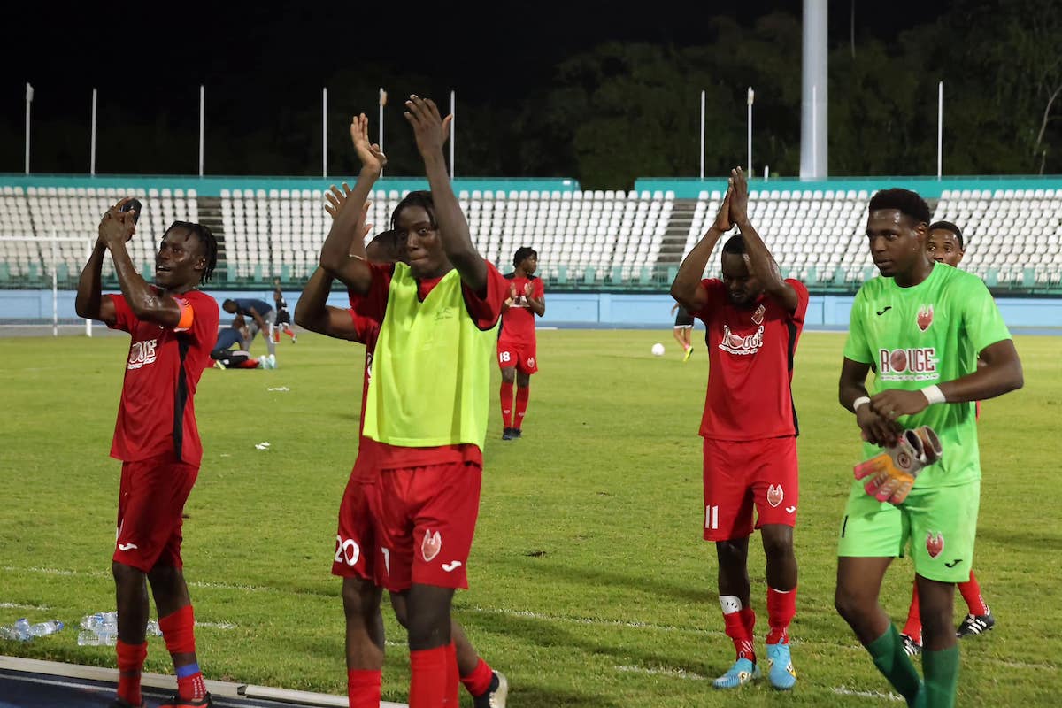 1976 FC Phoenix applaud their fans after defeating Defence Force 2-0 at Dwight Yorke Stadium, Bacolet, Tobago on Sunday, February 18th 2024.