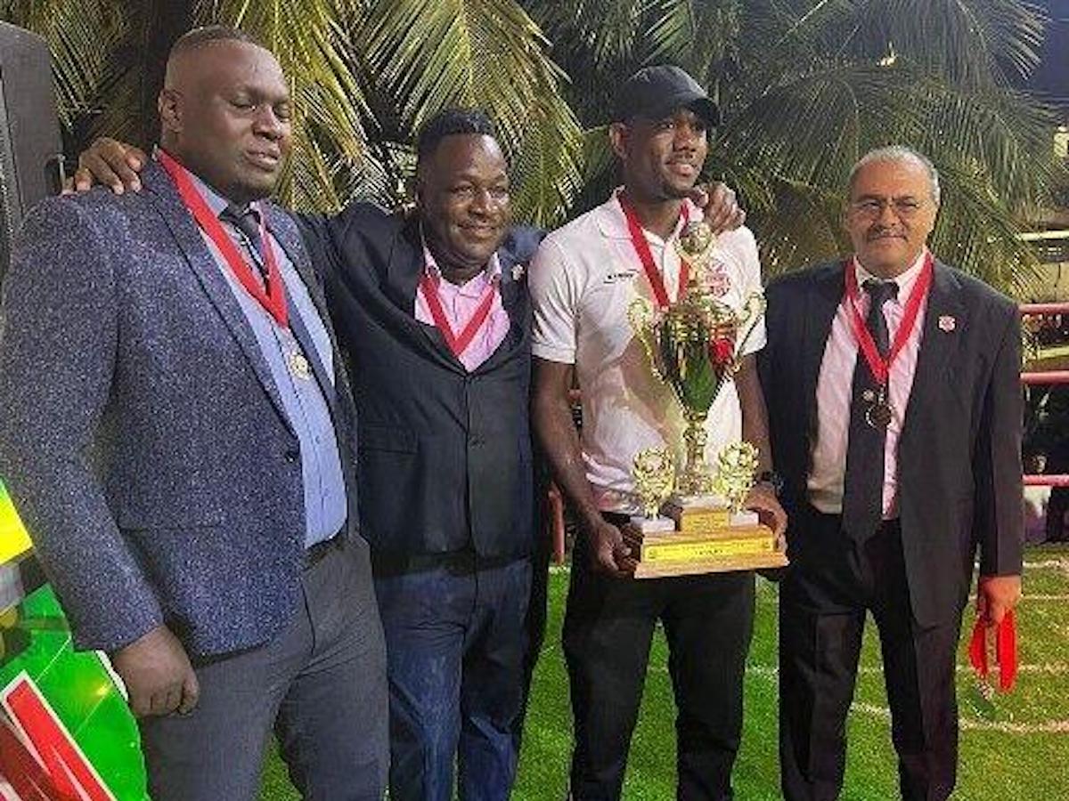 FLASHBACK: Ascension officials at the presentation ceremony for the 2022 Ascension Tournament, which was won by Terminix La Horquetta Rangers. Tournament director Kieron Edwards, from left, Terminix La Horquetta Rangers coach Dave Quamina, and defender Leslie Russell and Ascension Tournament managing director Richard Ferguson.