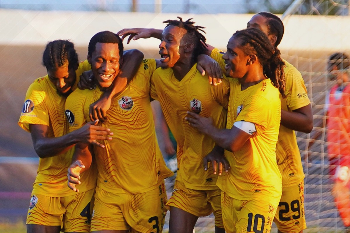 AC Port of Spain's Maurice Ford (second from left) is congratulated by his teammates after scoring the opening goal in a 2-0 win over Morvant Caledonia United at the Arima Velodrome on Sunday, November 26th 2023.