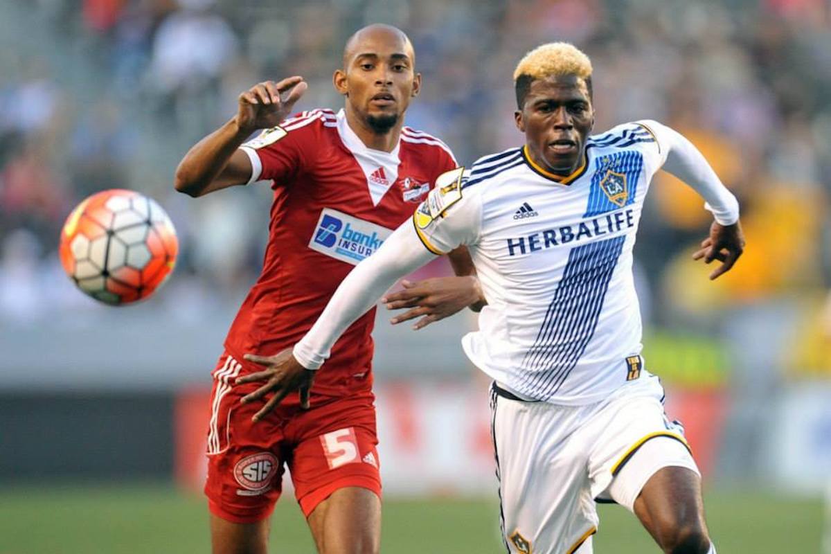 August 6, 2015; Los Angeles, CA, USA; Los Angeles Galaxy forward Gyasi Zardes (11) plays for the ball against Central FC defender Akeem Benjamin (5) during the first half at StubHub Center. Mandatory Credit: Gary A. Vasquez-USA TODAY Sports