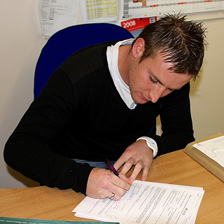 Chris Birchall signs