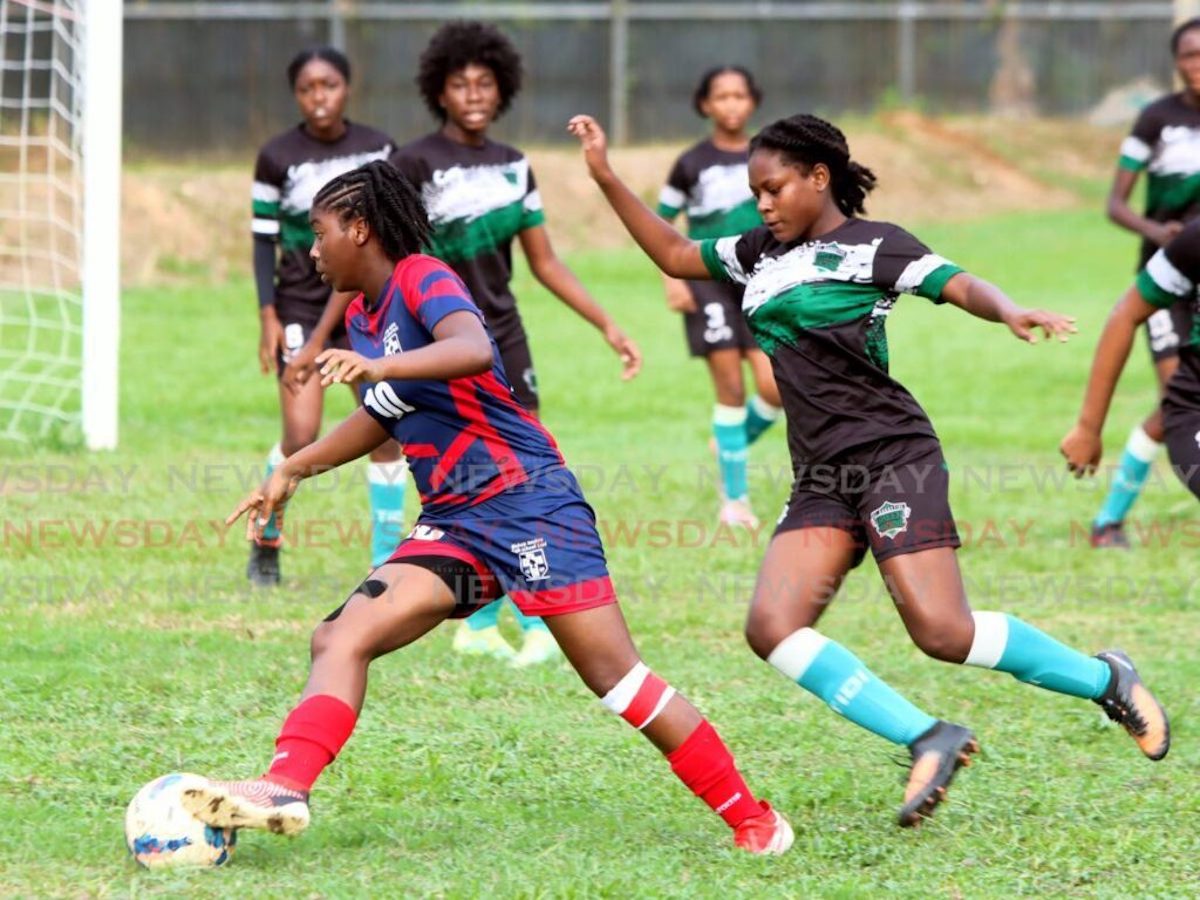 Orielle Martin of Bishop Anstey High School East, left, turns towards goal as Felicia Rocke of St Augustine Secondary School defends, during their Secondary School Football League Championship match, at St Augustine Secondary School on Sunday, October 22nd 2023. PHOTO BY: Angelo Marcelle