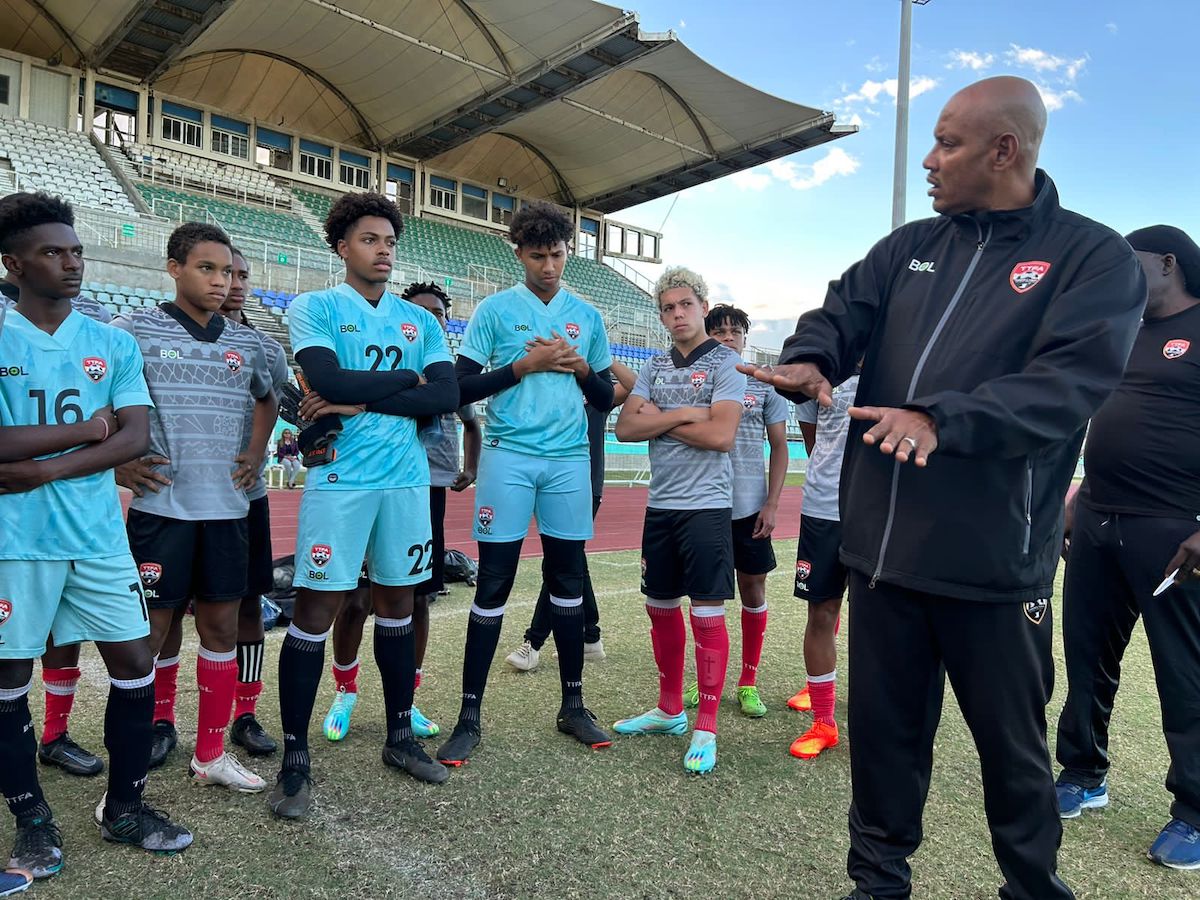 T&T men's U17 head coach Shawn Cooper speaks with members of the team, on Wednesday, at the Manny Ramjohn Stadium. - David Scarlett