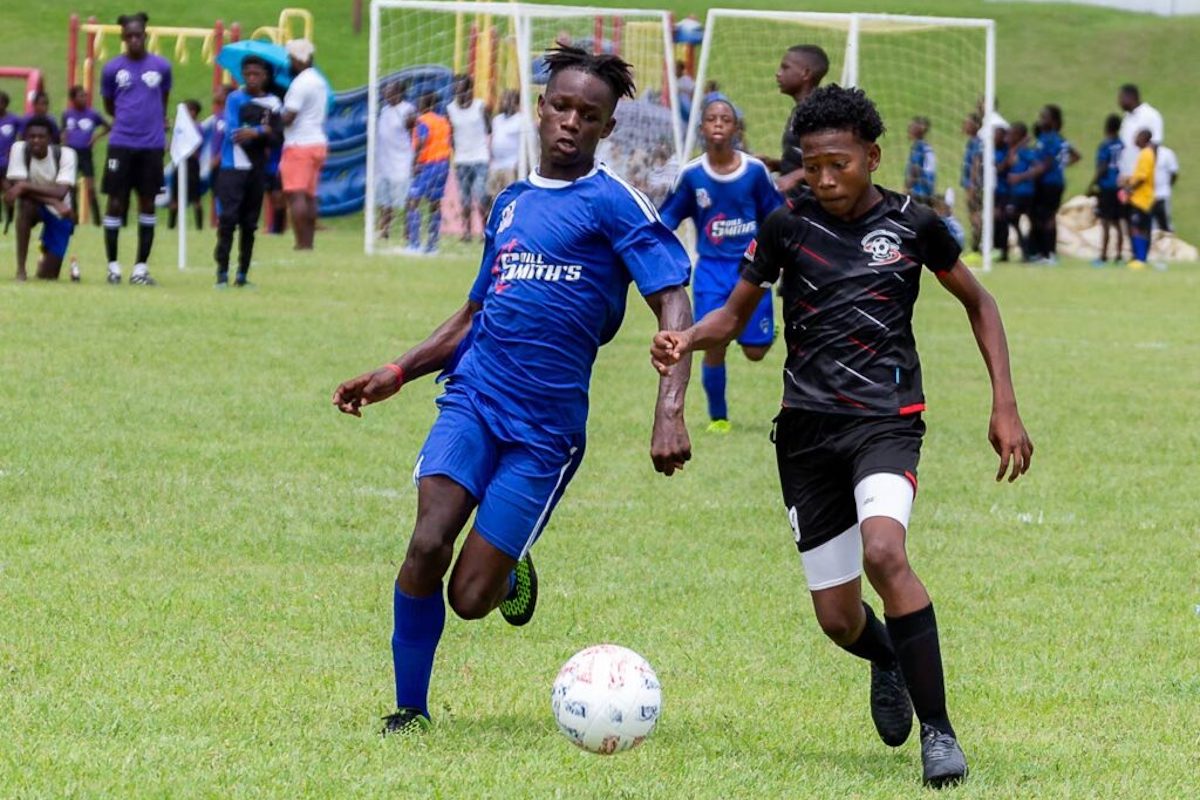 Ball Blasterz’ Malachi Peters, left,and Cox Football Academy’s Keon De La Rosa battle for possession during the boys’ under 15 match, on Saturday July 16th 2022, at the 7vs7 Football Tournament at Speyside Recreation Grounds. The tournament was hosted by Kennya ‘Yaya’ Cordner. - PHOTO: David Reid
