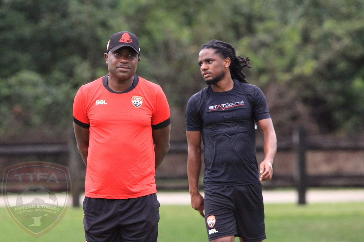 Trinidad and Tobago Interim Head Coach Angus Eve and midfielder Duane Muckette during a training session in Boca Raton, Florida