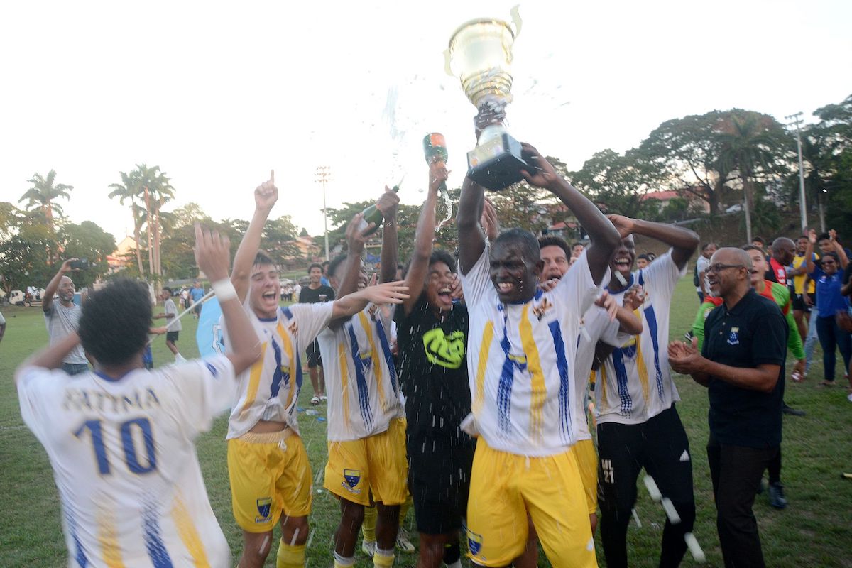 Fatima College players and students celebrate after winning their Secondary School Football League (SSFL) match against Naparima College at Naparima College grounds, Lewis Street, San Fernando on October 28, 2023. Fatima won 2-1. PHOTO BY: Innis Francis