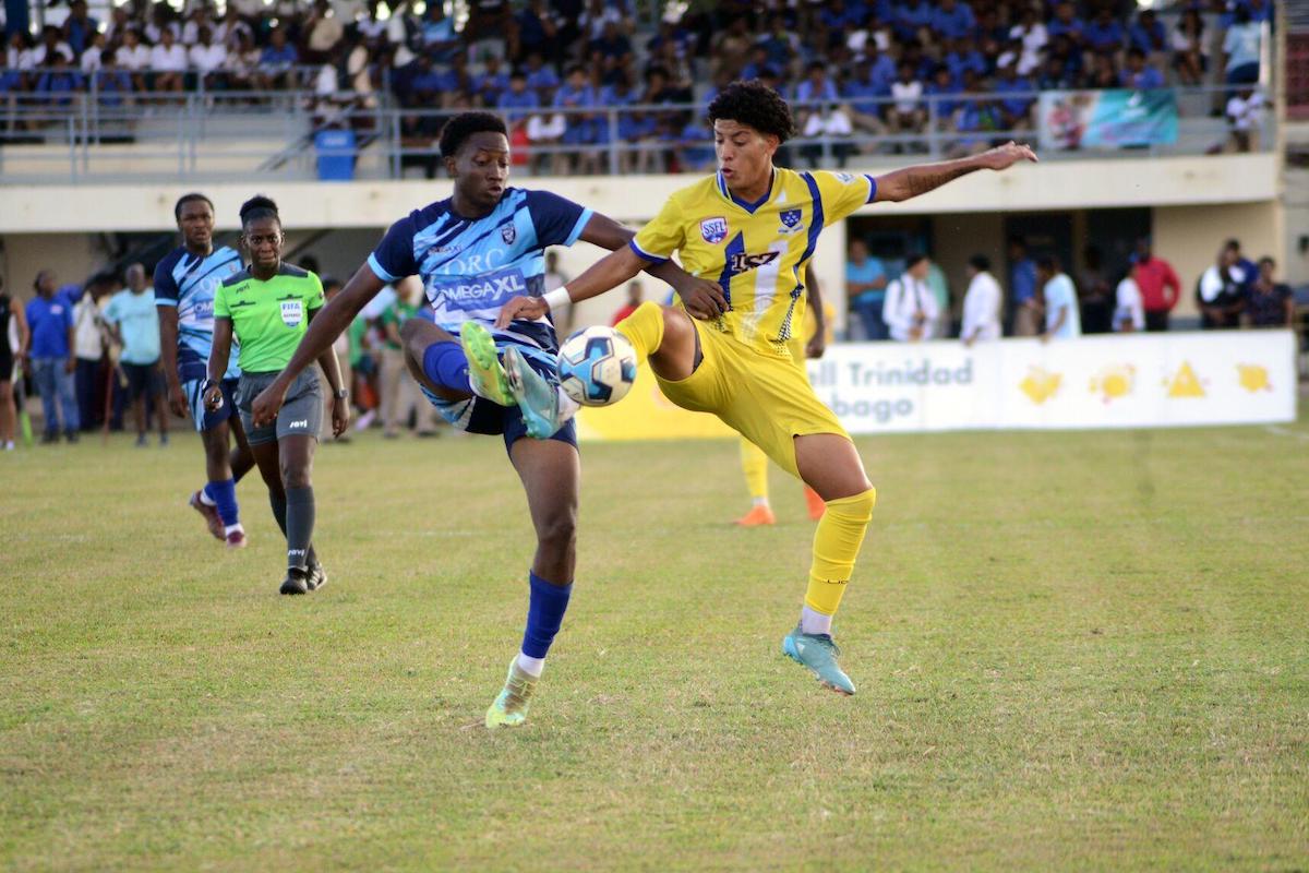 Fatima College’s Aidan De Gannes, right, and Teshaun Franklyn of QRC contest possession during their Secondary Schools Football League Premier Division clash at Fatima Ground, Mucurapo on Wednesday, October 11th 2023. PHOTO: Ishmael Salandy