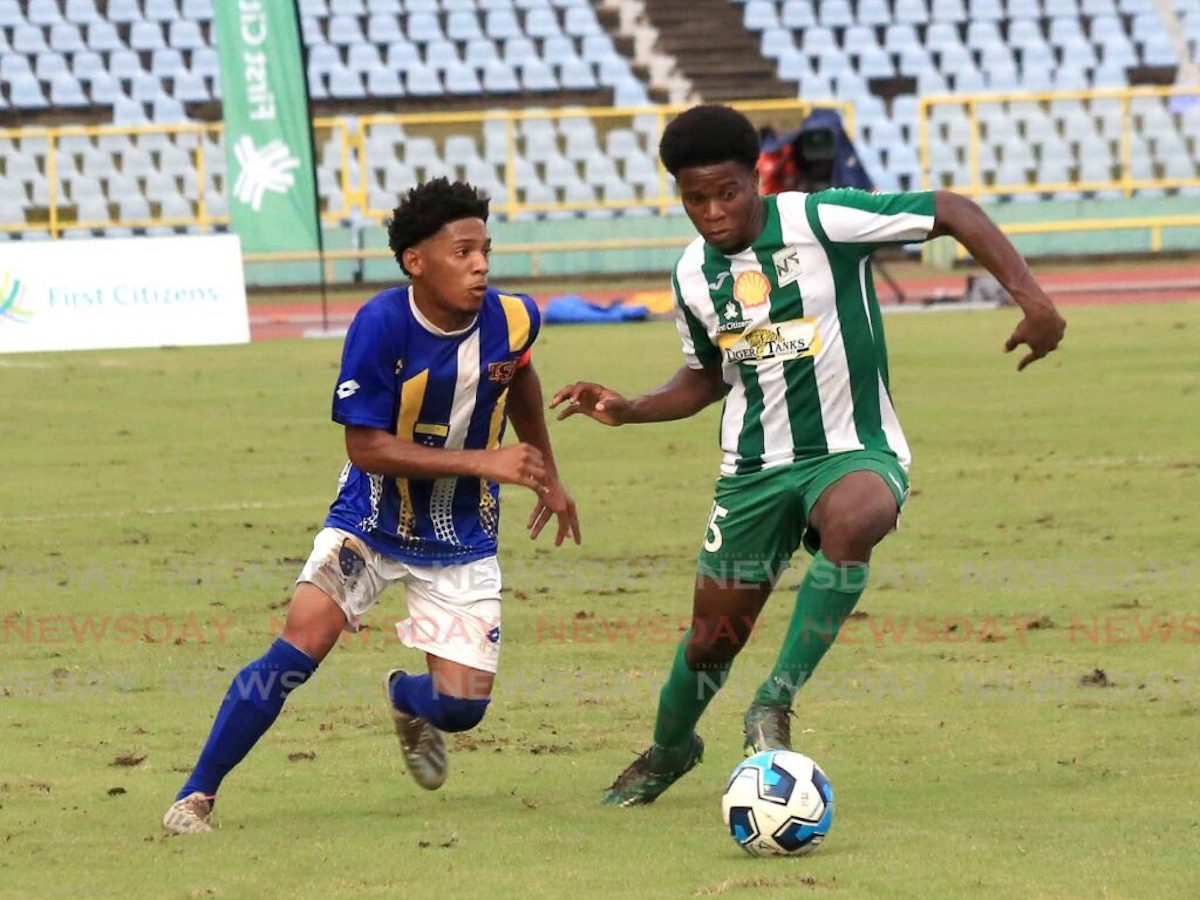 San Juan North Secondary’s Kent Guy (R) dribbles the ball away from Fatima College’s Christian Bailey, during the SSFL Premeirship division semi-final, on Saturday October 22nd 2022, at the Hasely Crawford Stadium, Port of Spain. - SUREASH CHOLAI