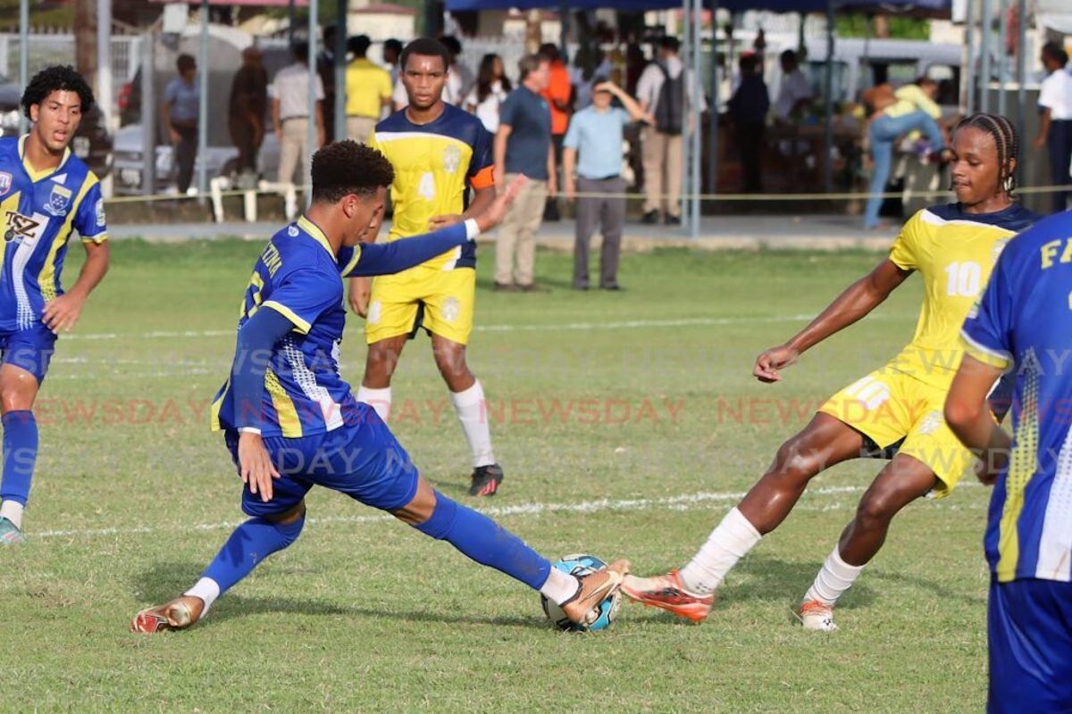 Fatima Colle's Kade Collier and Joshua Figaro of Trinity College East, right, clash for the ball in a Secondary Schools Football League match at Fatima ground, Mucurapo, Wednesday, October 25th 2023. PHOTO BY: Roger Jacob