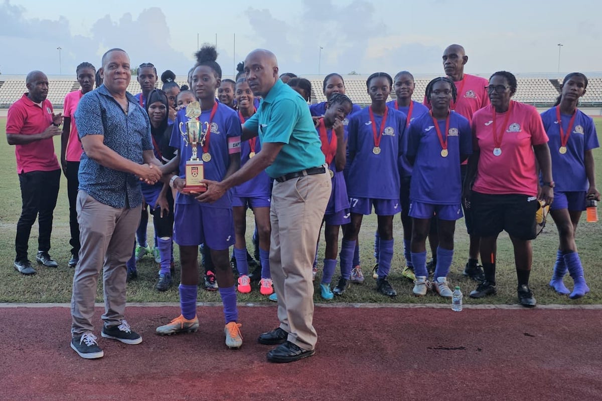 Five Rivers Secondary Girls receive their East Zone Intercol trophy from SSFL President Merere Gonzales after defeating San Juan North Secondary at the Larry Gomes Stadium, Arima on Sunday, November 26th 2023.