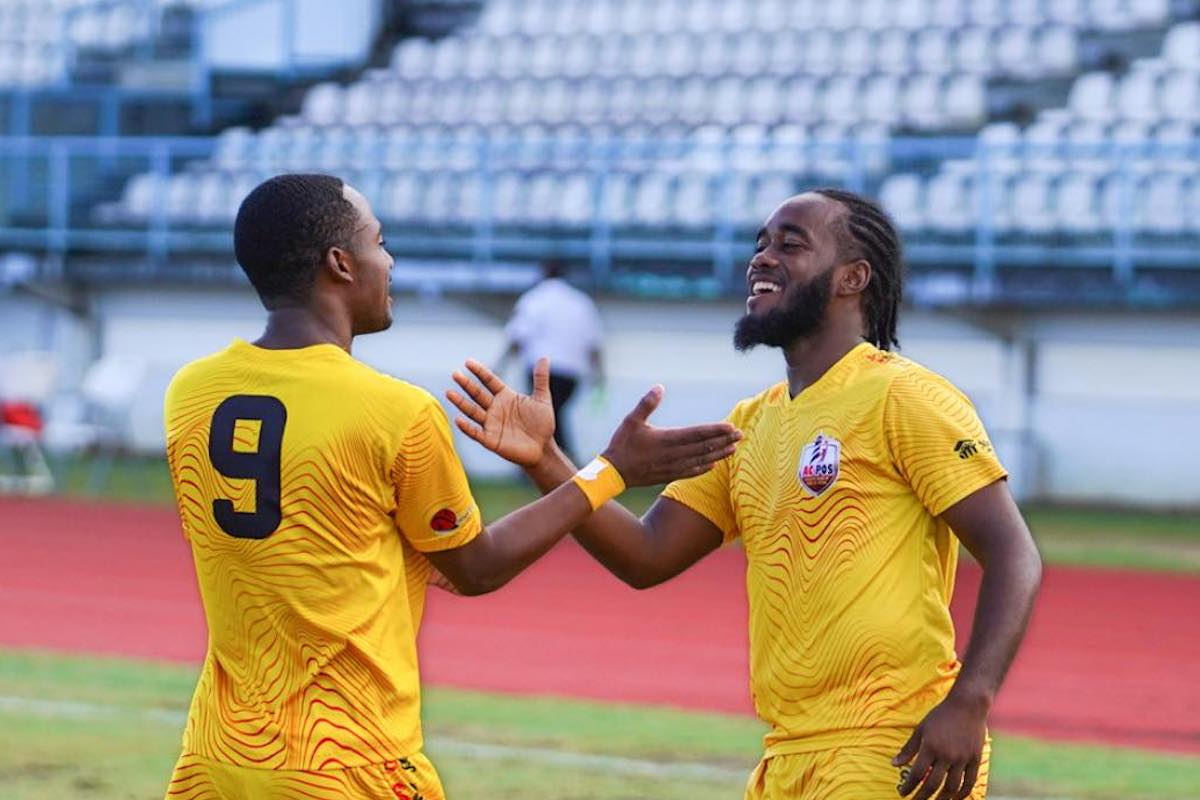 Jomoul Francois (left) and Che Benny (right) celebrate a goal during AC Port of Spain's 6-0 hammering of Prisons FC on Saturday, June 17th 2023.