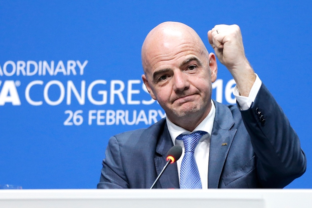 In this Friday, Feb. 26, 2016 file photo, newly elected FIFA president Gianni Infantino of Switzerland as he raises an arm during a press conference after the second election round during the extraordinary FIFA congress in Zurich, Switzerland.(AP Photo/Michael Probst, File)