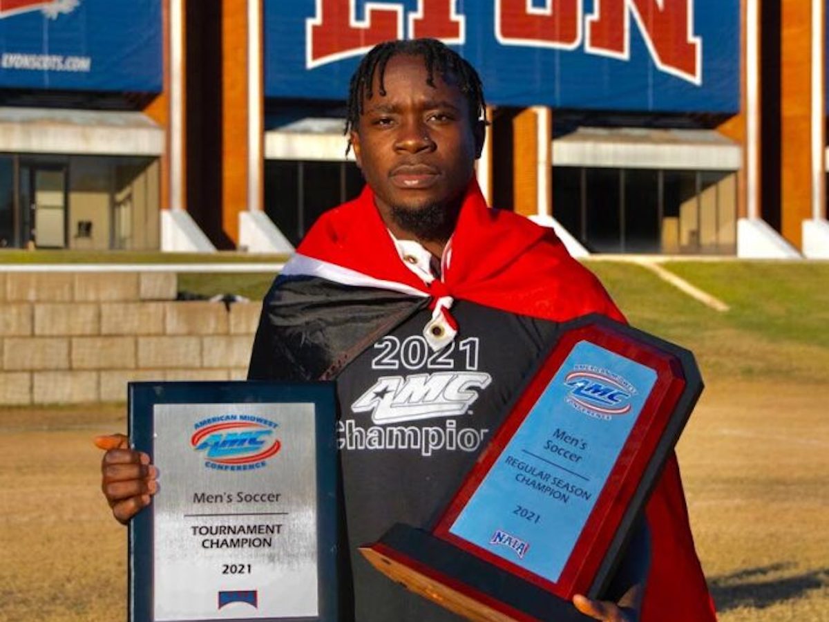 Ronaldo Jacob shows two plaques awarded to him for the regular football season in their performance against Coumbia college and the tournament champion where they beat Harris-Stowe State university.