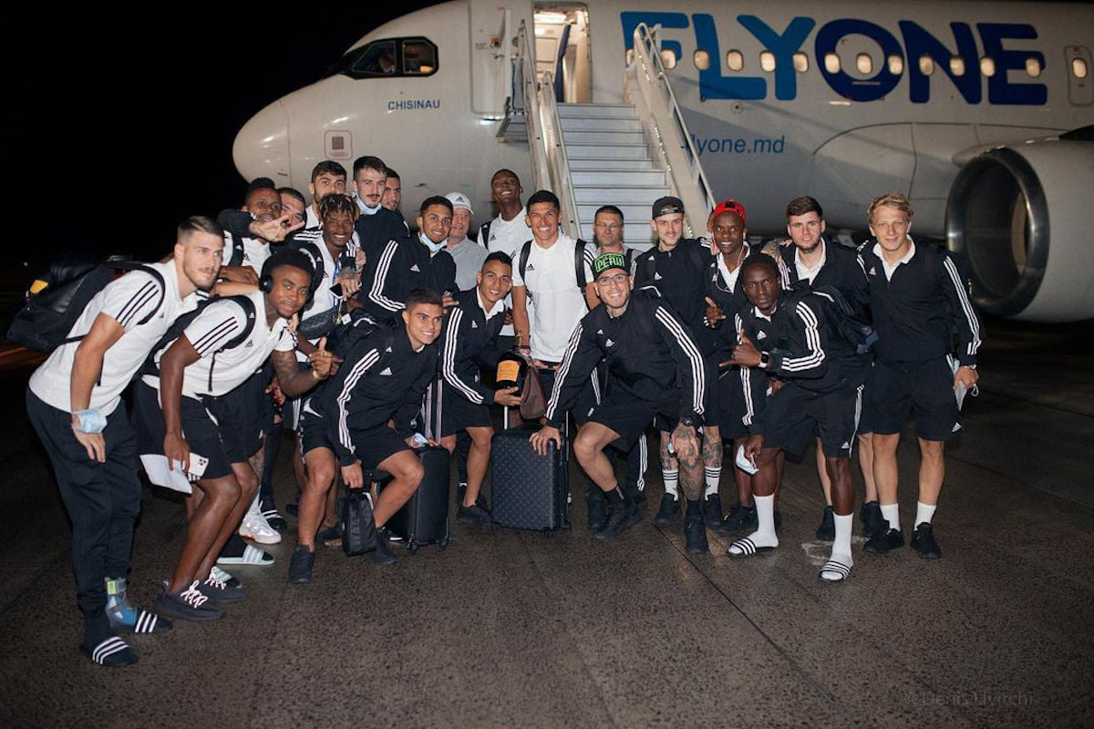 Keston Julien (second from left) and his FC Sheriff Tiraspol teammates upon their return from Croatia after qualifying for the 2021/22 UEFA Champions League at the expense of Dinamo Zagreb.