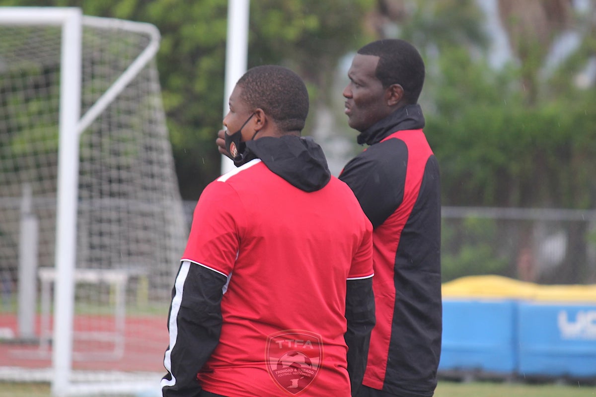 Senior Team Goalkeeper Coach Kelvin Jack (right) watches a training session in the Bahamas together with Assistant Coach Derek King (left)