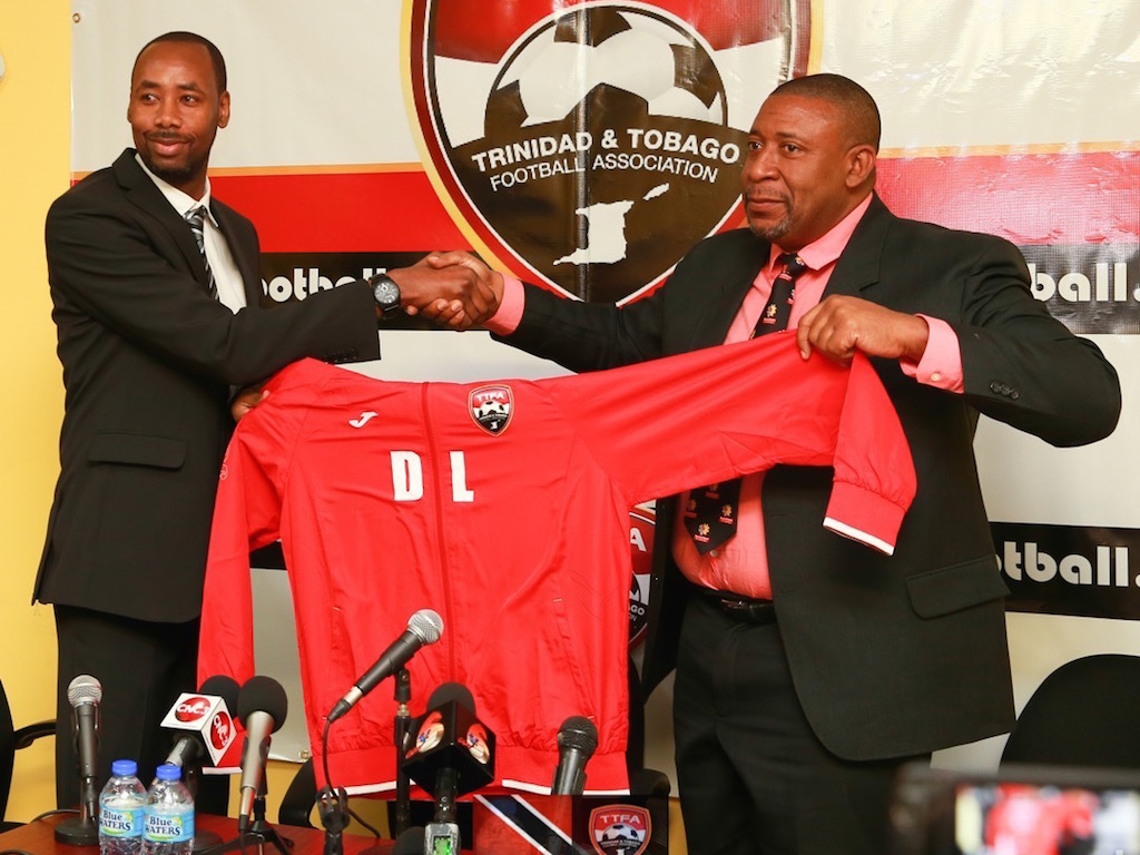 Mike Berry's client former T&T Head Coach Dennis Lawrence (left) with then TTFA President David John-Williams (right)