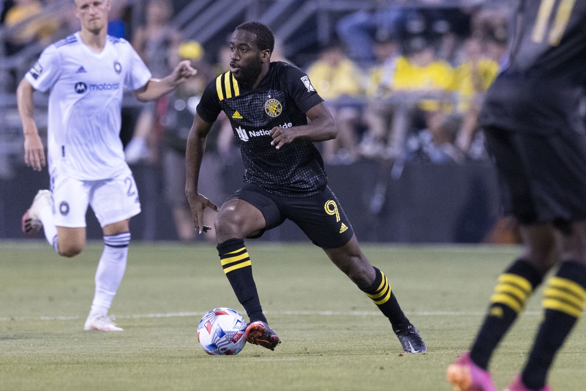 Columbus Crew SC midfielder Kevin Molino (9) advances the ball against the Chicago Fire in the second half during the final game at Historic Crew Stadium. Mandatory Credit: Greg Bartram-USA TODAY Sports