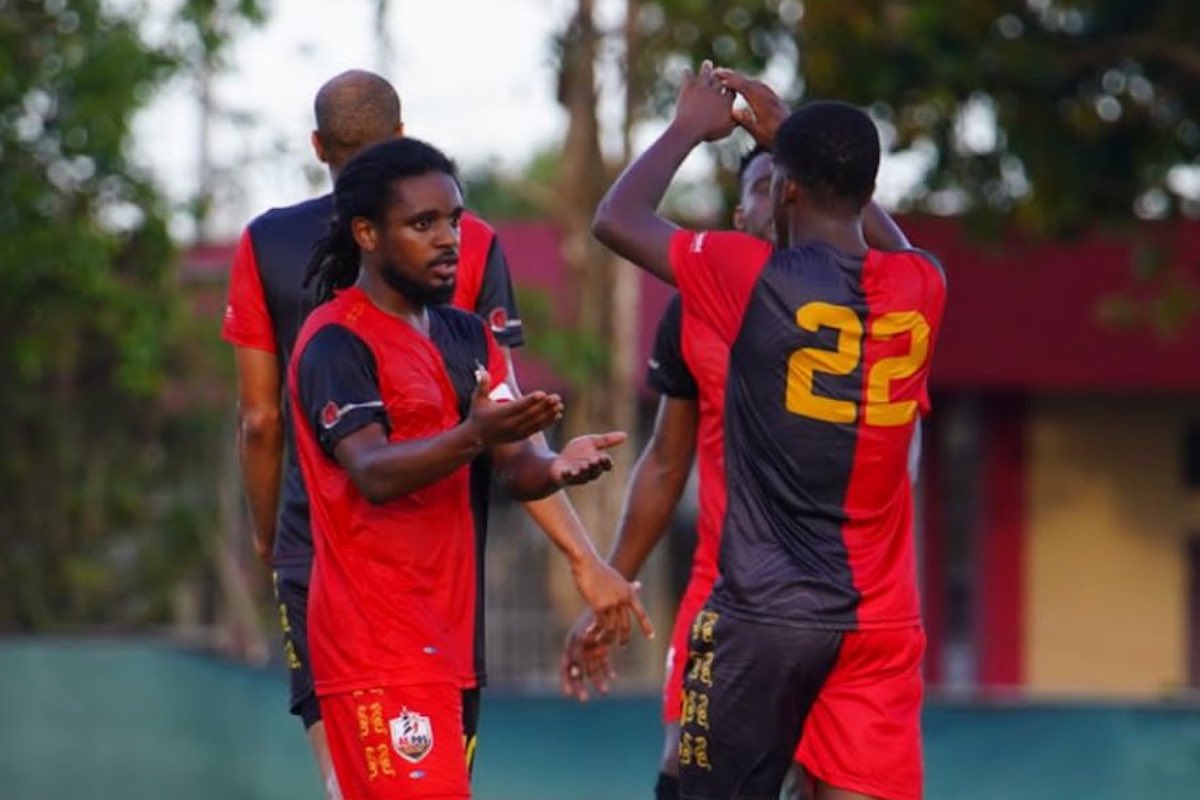 AC Port of Spain's Duane Muckette (left) is congratulated after scoring the opening goal in a 2-0 victory against Point Fortin Civic at the La Horquetta Recreation Ground on Wednesday, May 10th 2023.