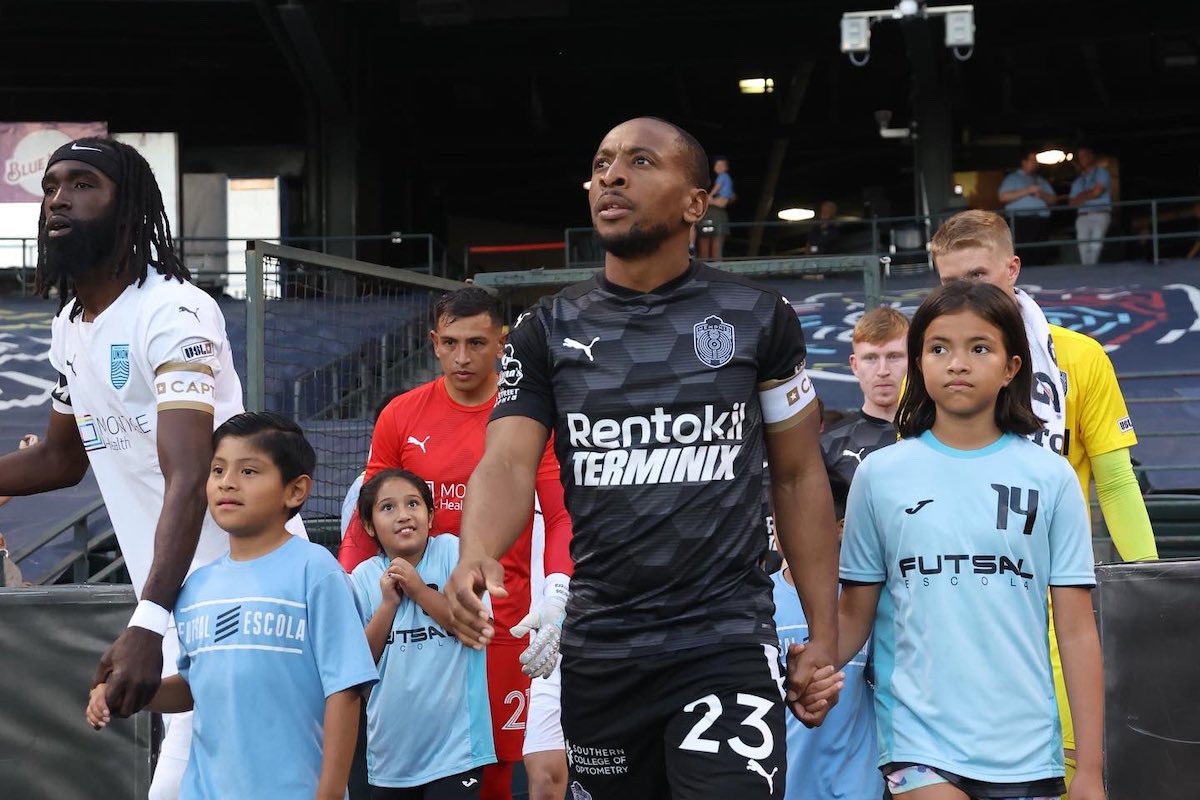 Memphis 901 FC Captain Leston Paul leads his team onto the pitch to face Monterey Bay FC at AutoZone Park, Memphis, TN on Saturday, September 9th 2023.