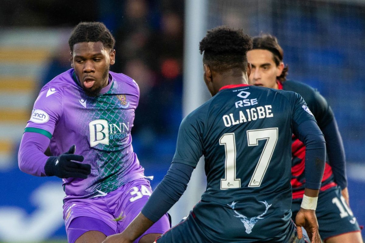 DINGWALL, SCOTLAND - DECEMBER 17: St Johnstone's Daniel Phillips (L) and Ross County's Kazeem Olaigbe during a cinch Premiership match between Ross County and St Johnstone at the Global Energy Stadium, on December 17 , 2022, in Dingwall, Scotland (Photo by Paul Devlin/SNS Group via Getty Images)