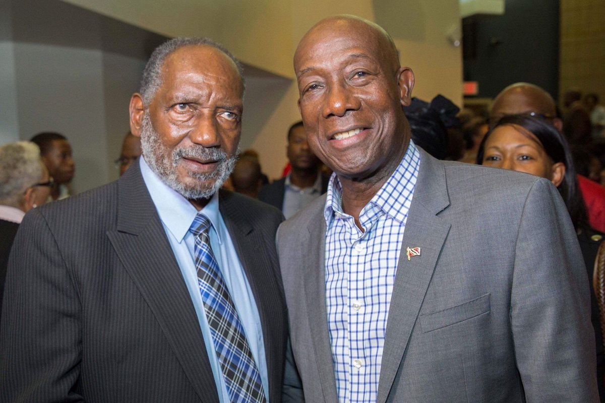 Former national goalkeeper and coach Lincoln Phillips, left, with T&T Prime Minister Dr Keith Rowley in September 2019.